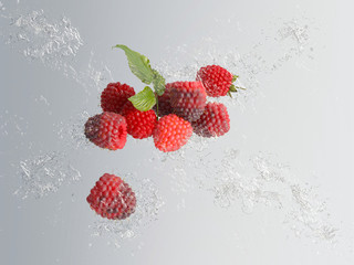 Delicious ripe red raspberries with water splash