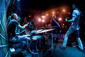 Fototapeta na wymiar Band performs on stage
