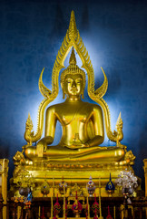 Gold Buddha statue in Wat Benchama Bophit. Bangkok, Thailand. 