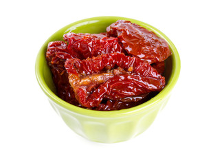 dried tomatoes in green bowl