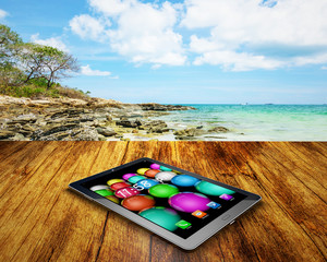tablet PC  on wooden table outdoors