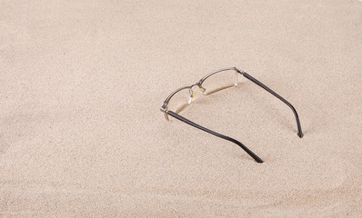 Glasses on the sand.