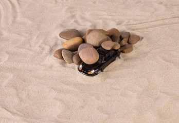 Fototapeta na wymiar Concept of black racing car on the sand.