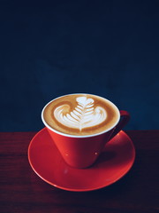 cup of coffee on the wooden desk