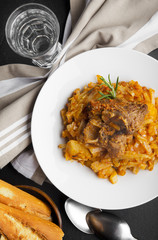 cabbage with meat. and French baguette. pork.