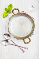 empty cookware. Italian lunch. a small frying pan, glass and fre