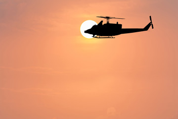 Fototapeta na wymiar sunrise in the morning and helicopter