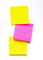 yellow and pink stickers on a white background