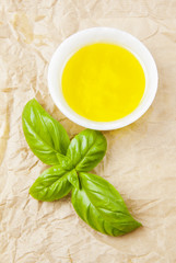 Italian cooking ingredients, fresh basil and olive oil with hot