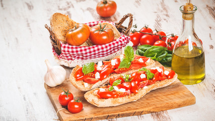 Italian starter, bruschetta with Sicilian red fresh tomato and m