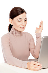 Portrait of  business woman sitting in front of laptop computer