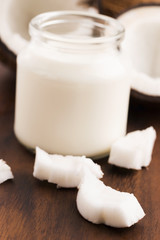 Coconut Milk in a glass on dark wooden background