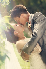 Bride and Groom Kissing Together in their Wedding Day