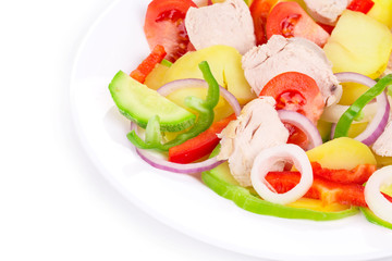 Warm meat salad with vegetables