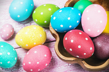Fototapeta na wymiar colored Easter eggs on wooden table