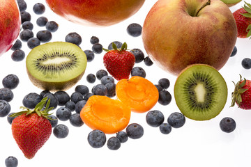 Halved Apricot And Kiwi Amidst Other Fruit