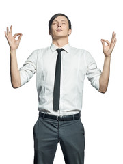 Young man in shirt  in zen position isolated on white background