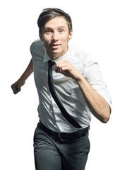 Young man running fast over white background