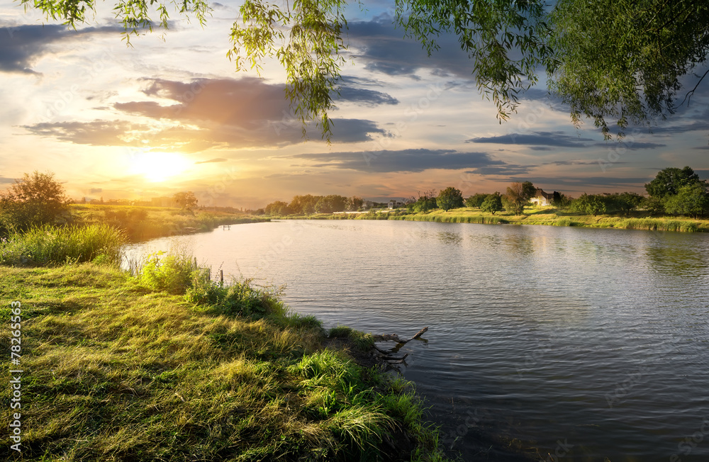 Wall mural sundown over river