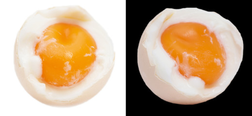 egg with yolk on black and white background