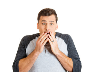 Smiling young man with surprised expression