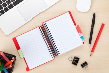 Office table with computer and supplies