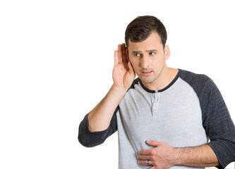 man with hand behind ear listening closely carefully 