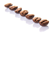 Roasted coffee bean over white background