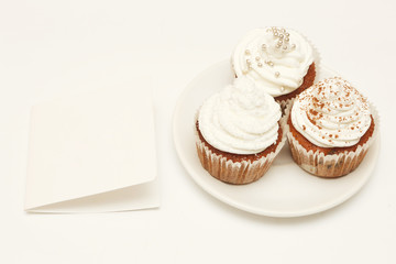 Cupcakes with whip cream and blank card - add own text