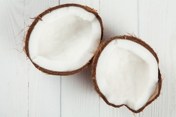 Cracked coconut on wooden table