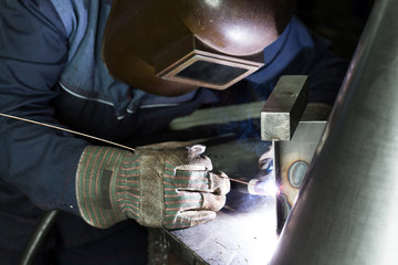 professional welder welding metal parts