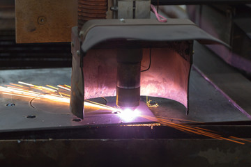 Laser cutting machine cuts steel metal sheet