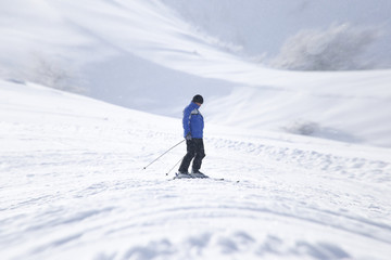 Fototapeta na wymiar Skier in high mountains