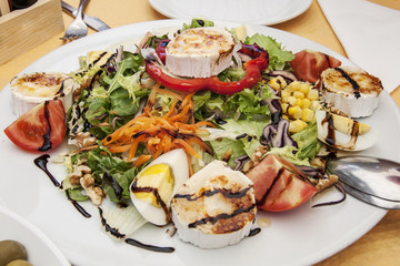salad Mediterranean salad with egg and brie cheese