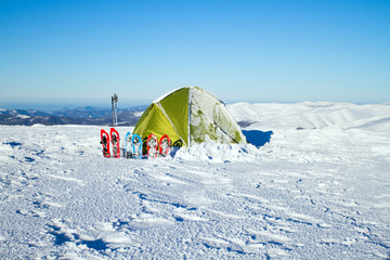 Camping during winter hiking in Carpathian mountains.