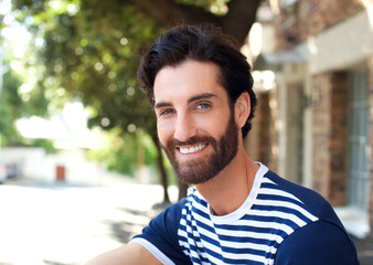 Smiling young man with beard