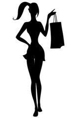 Silhouette of beautiful girl with shopping bags in hand