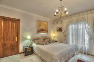Fototapeta na wymiar Bedroom in the villa