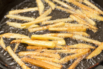 French fries fried in a pan