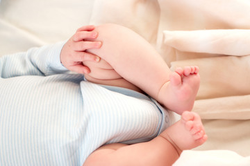 Fototapeta na wymiar Baby hand and legs