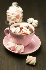 Hot chocolate in pink cup with marshmallows