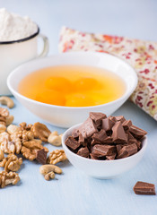 Chocolate chunks, eggs, butter, nuts and cup of flour