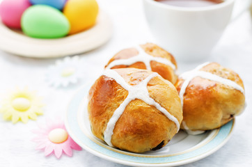 Easter buns with a cross and eggs