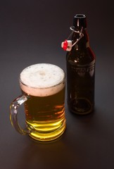 Half liter glass and bottle with traditional cap of czech beer