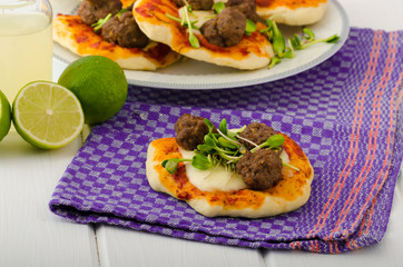 Mini pizza with meatballs