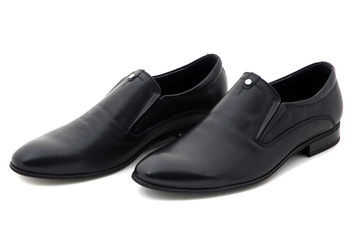 Black patent leather men shoes against white background. Male