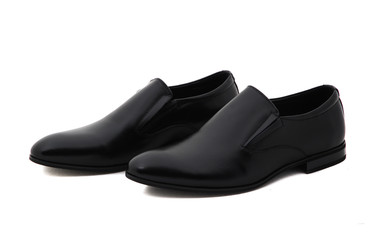 Black patent leather men shoes against white background. Male