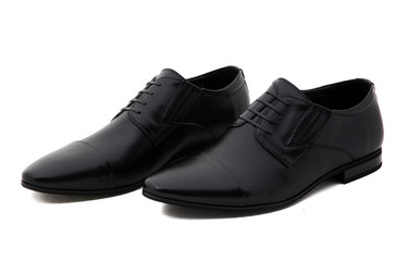 Black patent leather men shoes against white background. Male