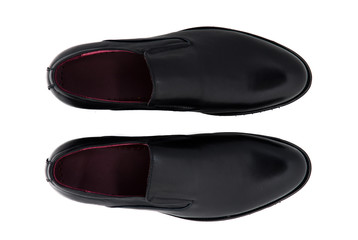 Black patent leather men shoes against white background. Male