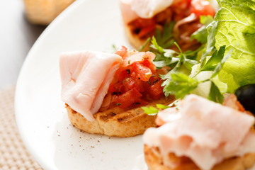 Bruschetta with tomato and ham